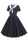 Vintage Zwart-Witte Polka Dot Jurk Met Vlinderdas